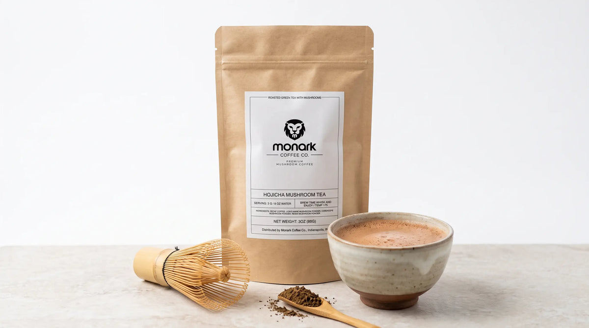 Monark Hojicha Mushroom Tea with a bamboo whisk and a bowl of hojicha latte