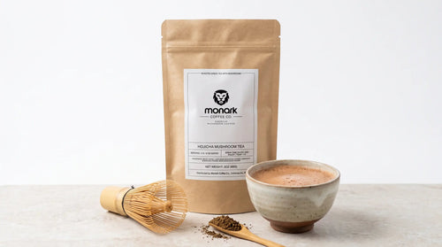 Monark Hojicha Mushroom Tea with a bamboo whisk and a bowl of hojicha latte